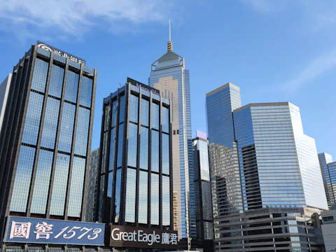 Close-up of modern skyscrapers reflecting sunlight in Hong Kong's business district