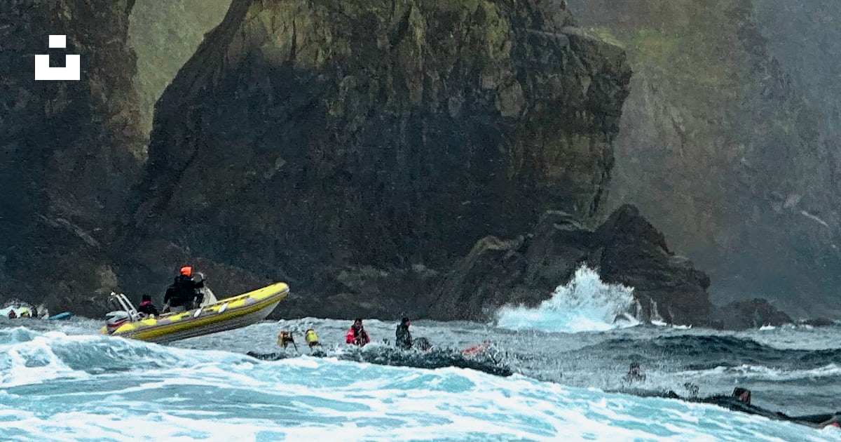 A group of people in a raft in the ocean photo – Free Ireland Image on ...
