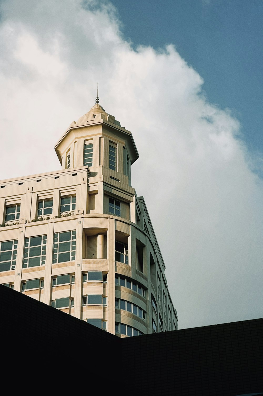 a tall building with a clock on the top of it