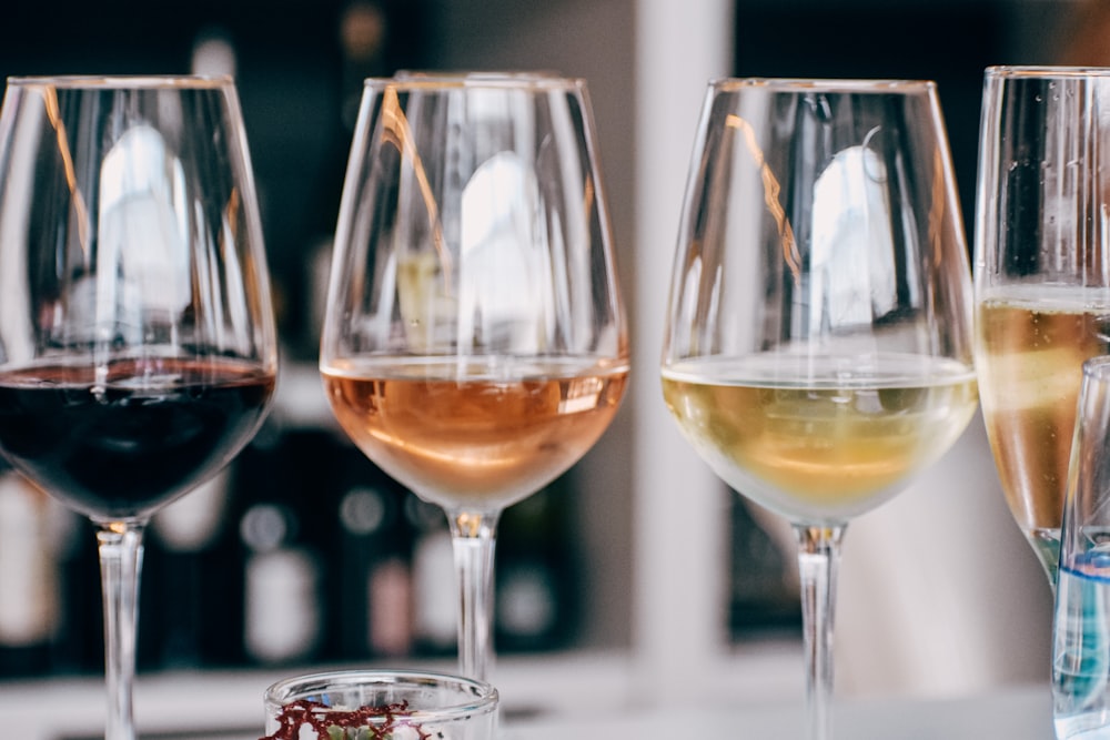 a group of wine glasses sitting on top of a table