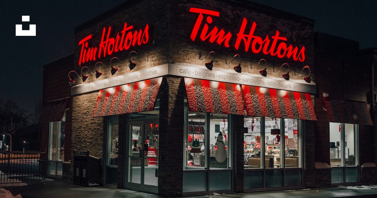 A tim hortons store lit up at night photo – Free Restaurant Image on ...
