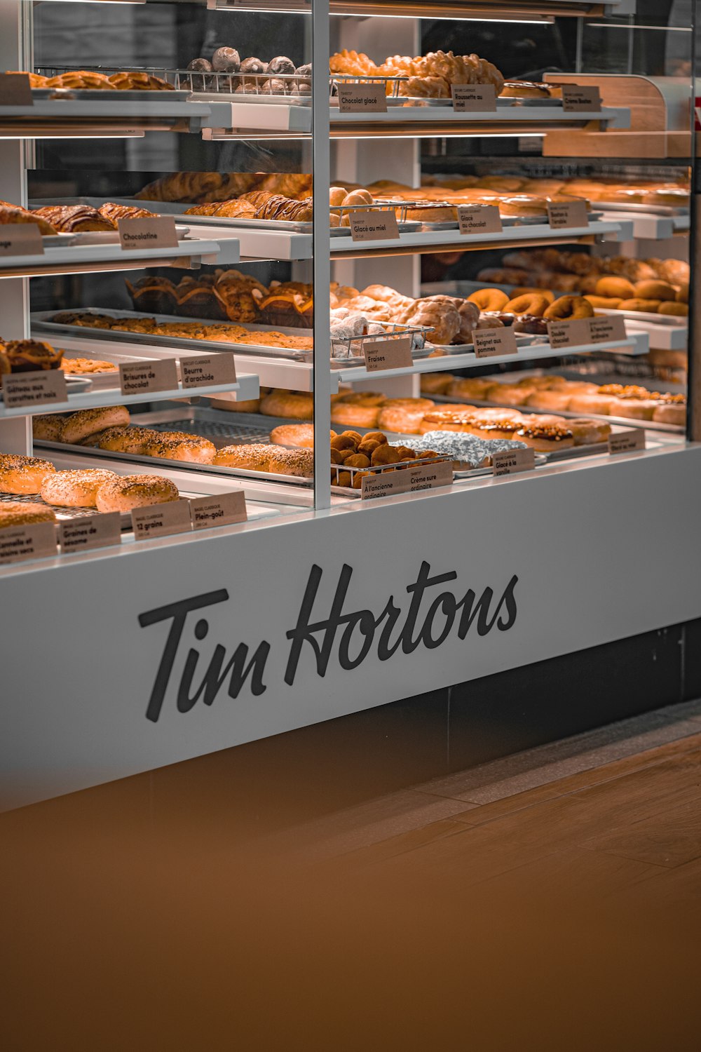 a display case filled with lots of donuts