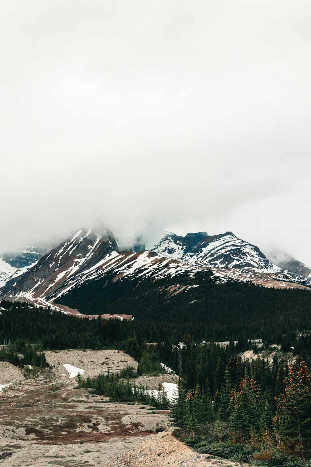 a view of a mountain range with snow on the mountains