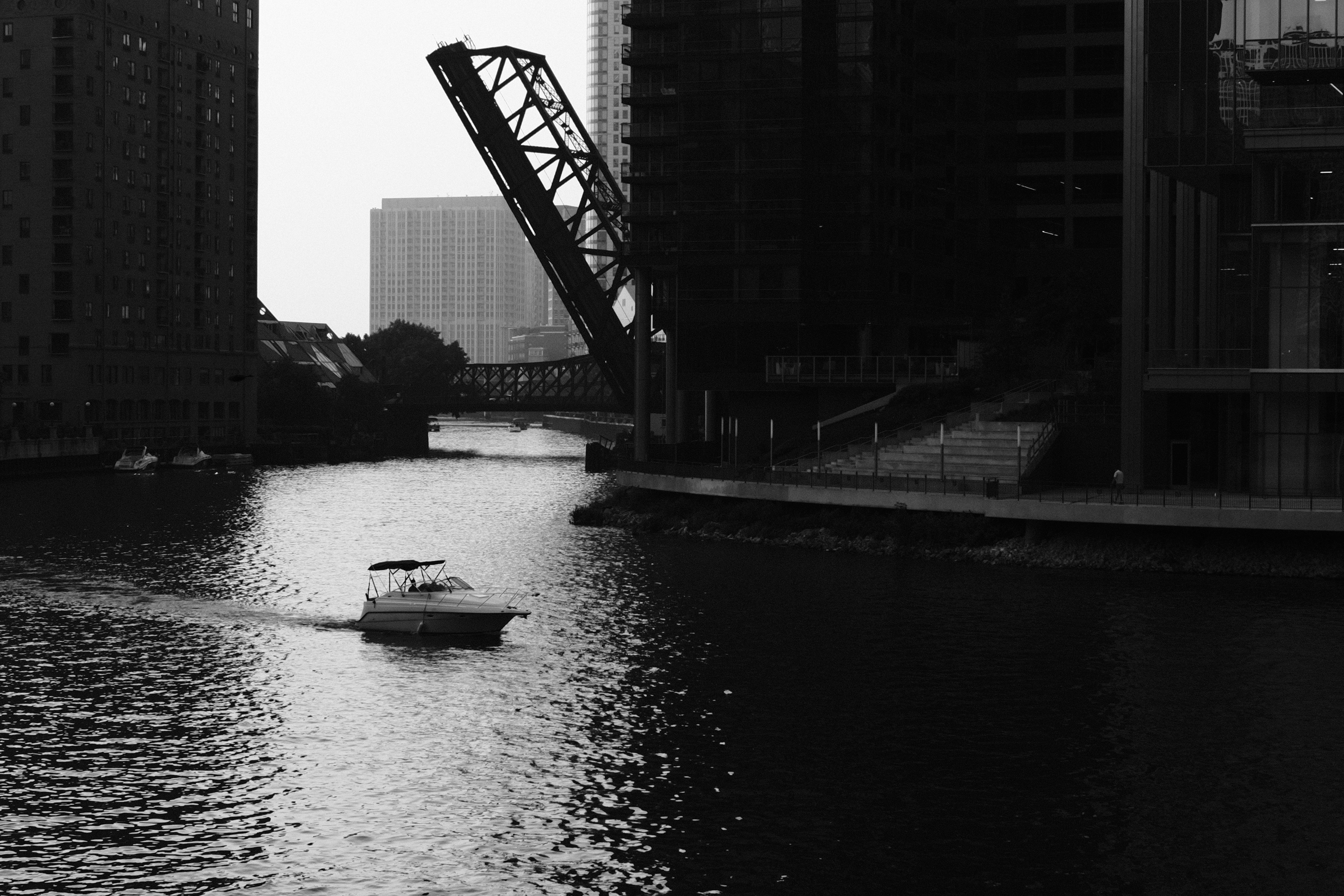 Chicago Riverwalk and skyline with a boat passing by - modern studio for rent