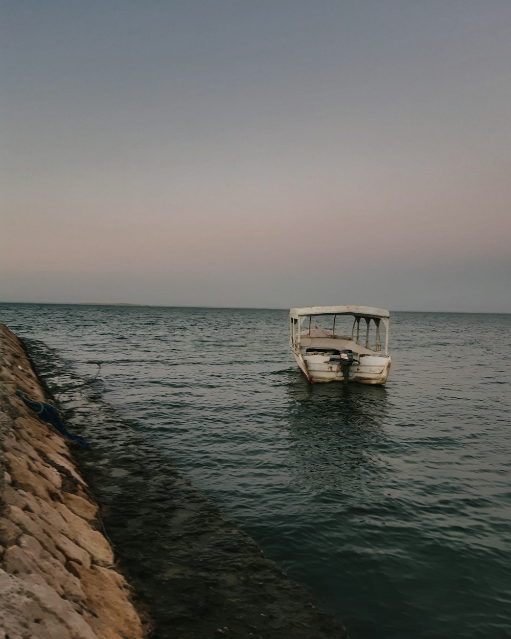 a boat floating on top of a body of water