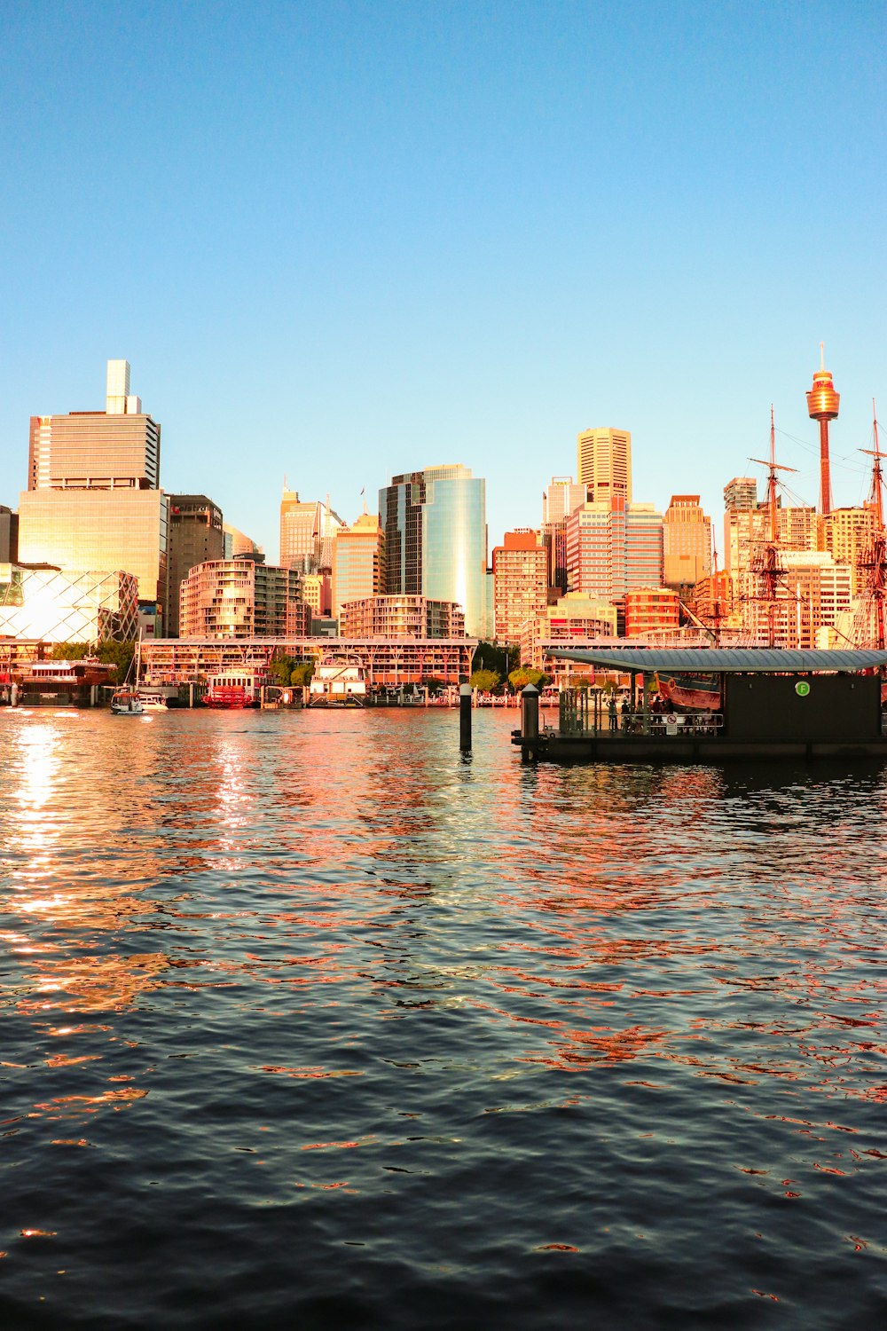 a large body of water with a city in the background