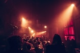 An atmospheric shot of a rave venue filled with lights.