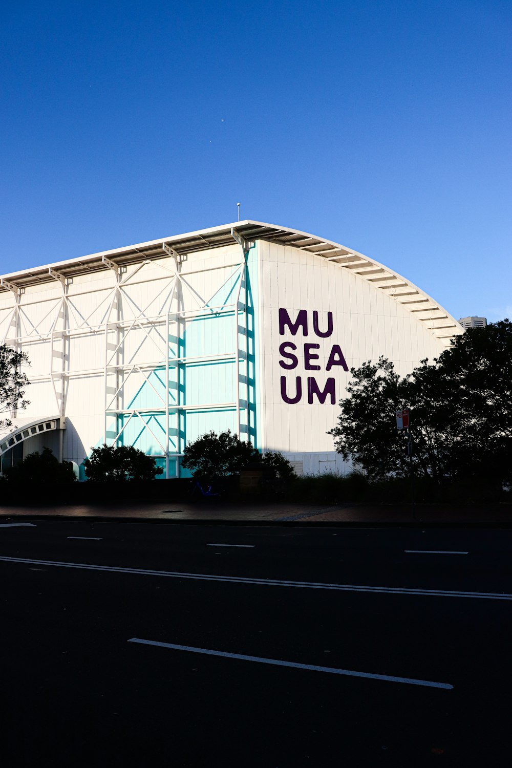 a large white building with a sign on the side of it