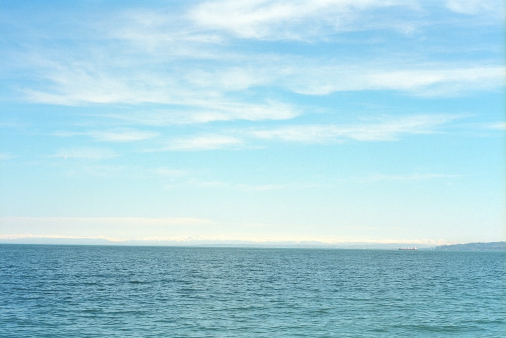 a boat floating on top of a large body of water