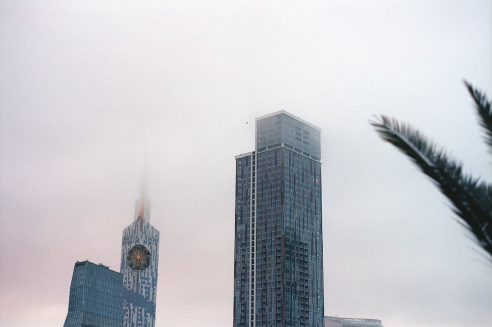 a tall building with a clock in the middle of it