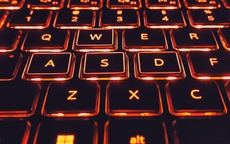 Visual keyboard highlighting the top and bottom rows in vibrant colors.