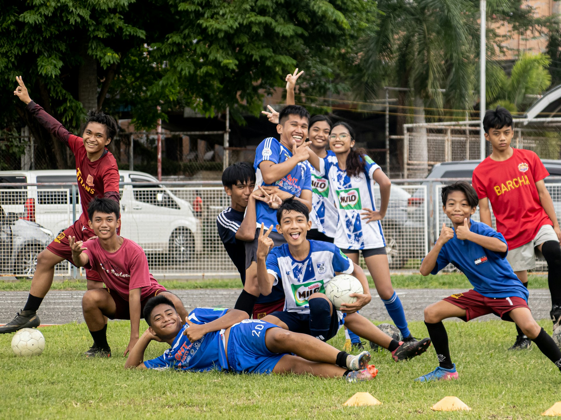 a group of young people playing a game of soccer