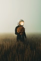 a person in a field with a light on their head