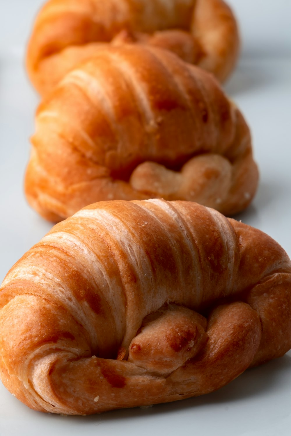 a group of croissants sitting on top of a white counter