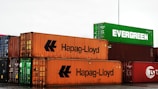 a large stack of shipping containers sitting next to each other