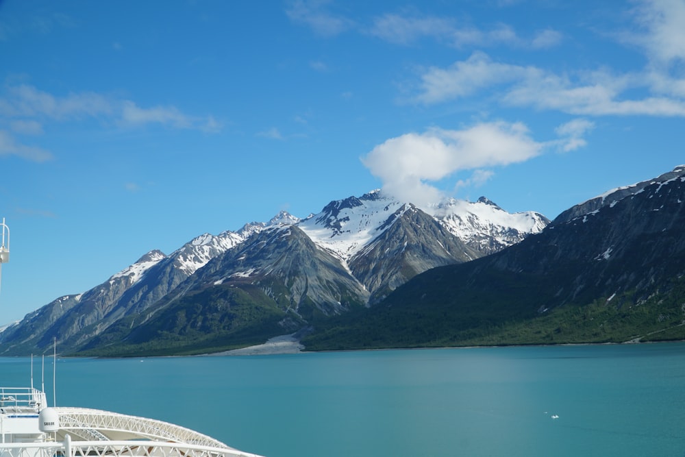 a large body of water with mountains in the background