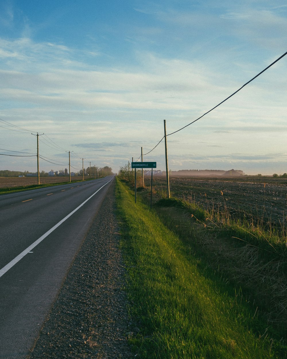 a road with a sign on the side of it