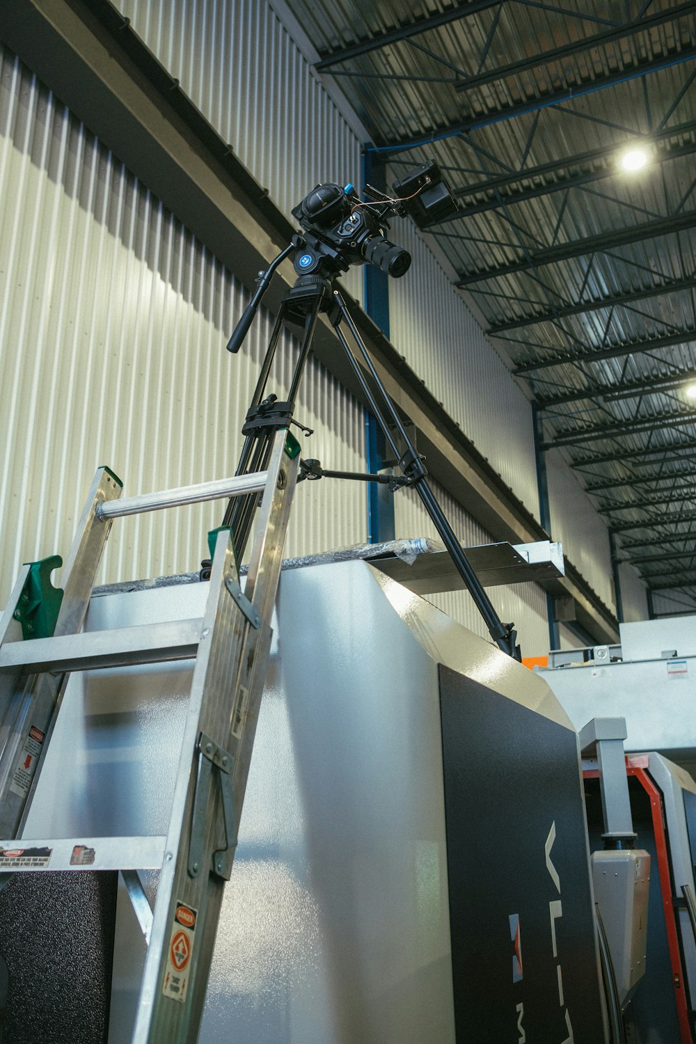 a man is working on a metal structure