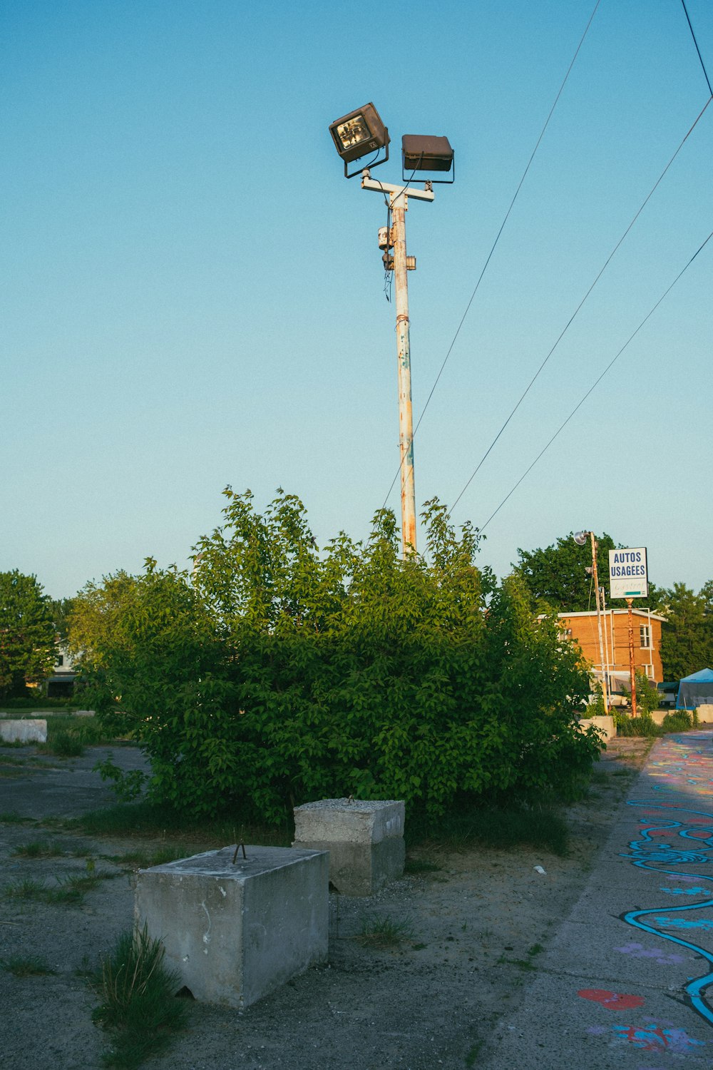 a couple of street lights sitting on top of a pole