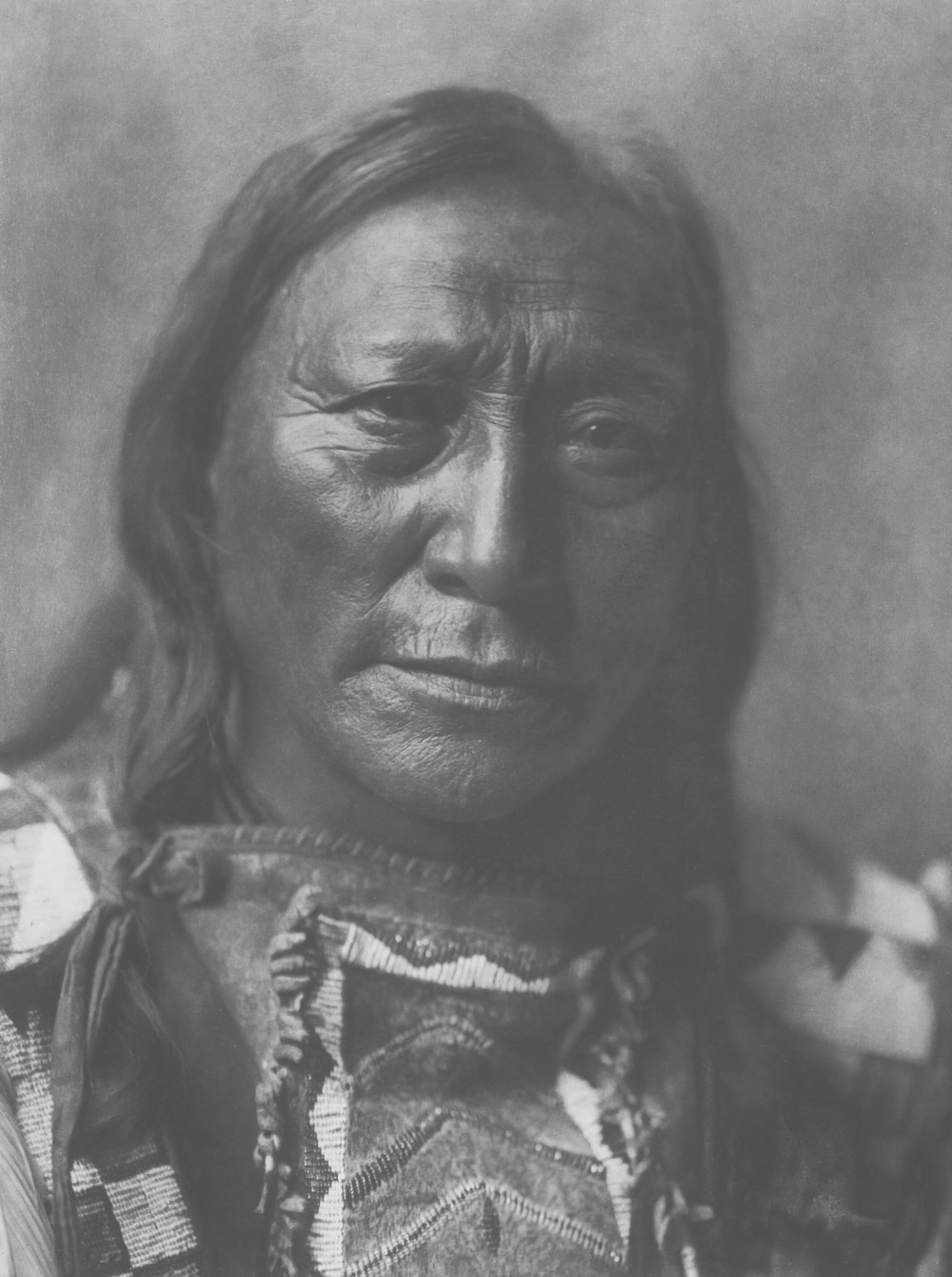 a black and white photo of a native american woman