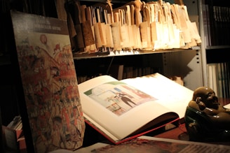 Smiling woman holding a Buddha-themed diary in a cozy, sunlit room.