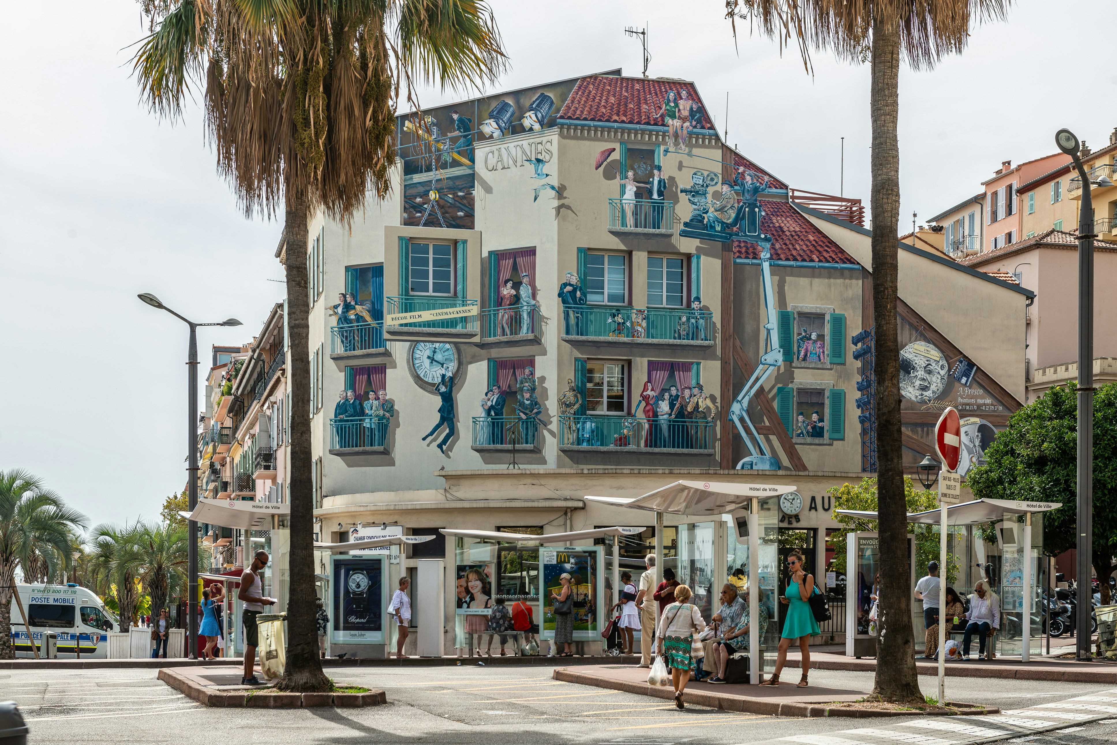 a group of people standing outside of a building