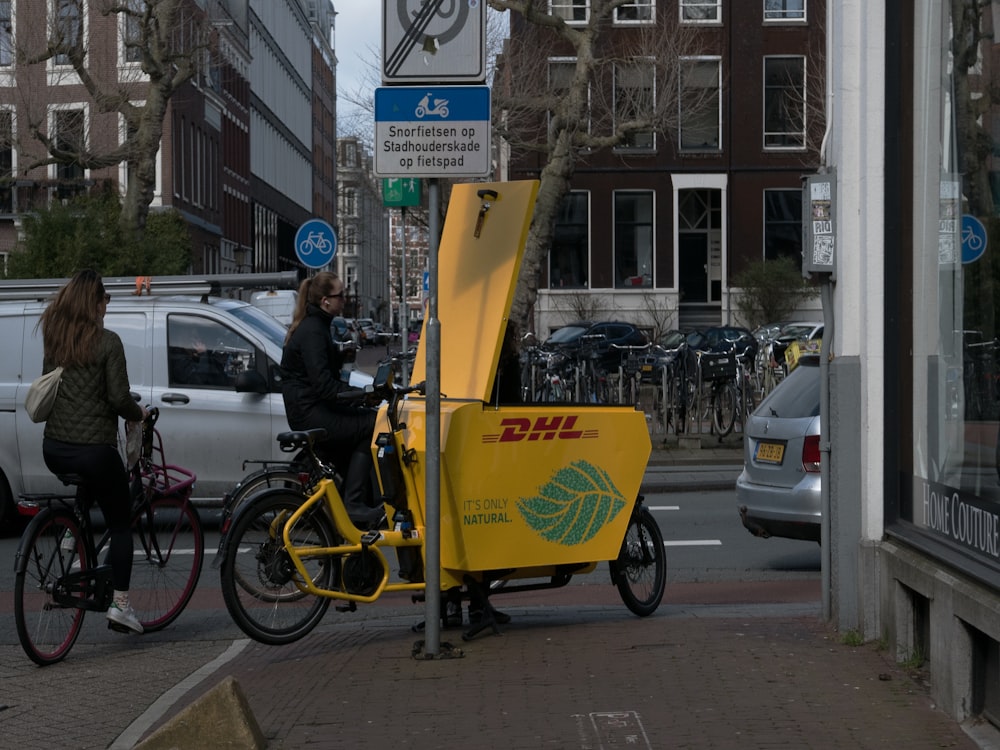 a person riding a bike on a city street