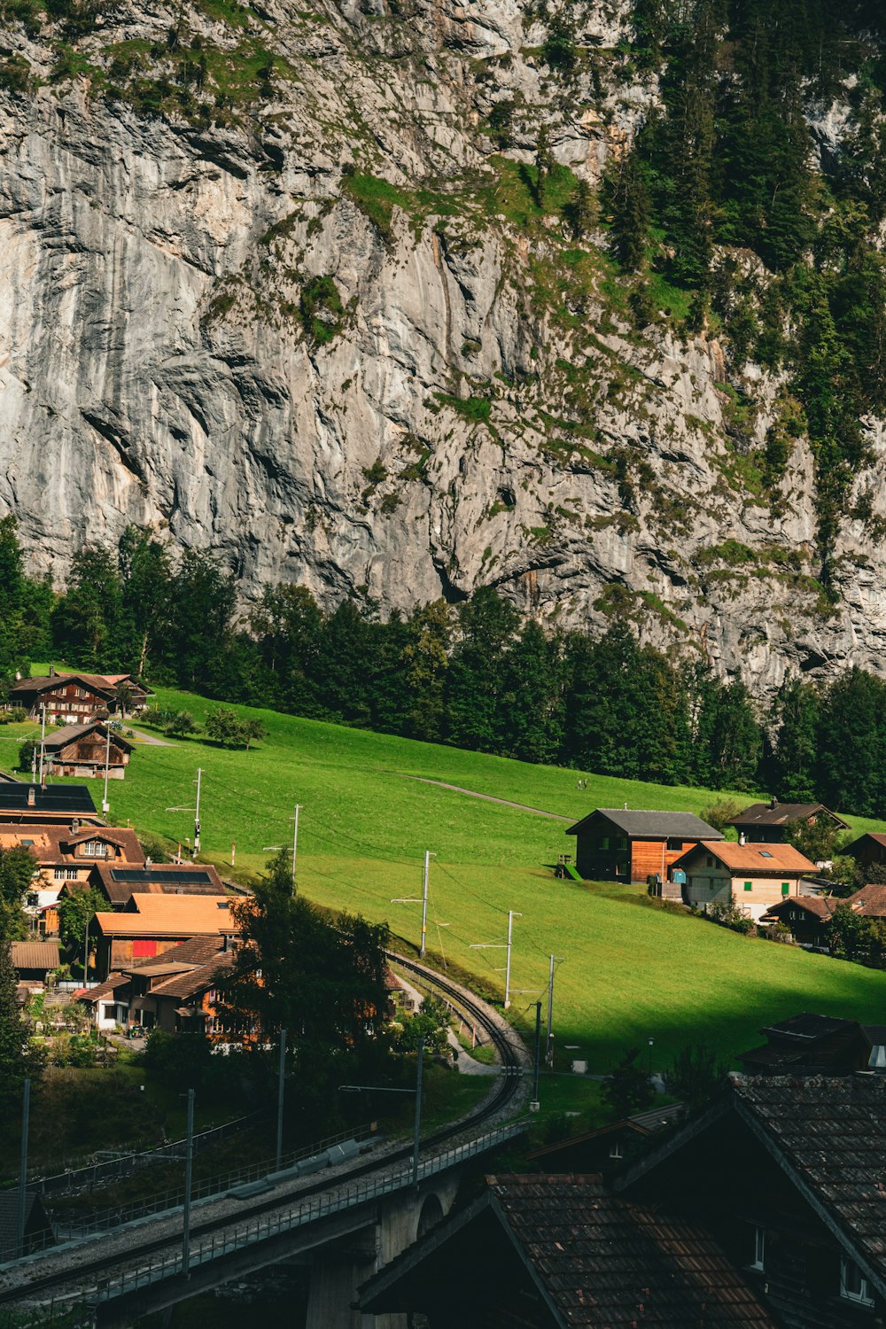 a scenic view of a village in the mountains