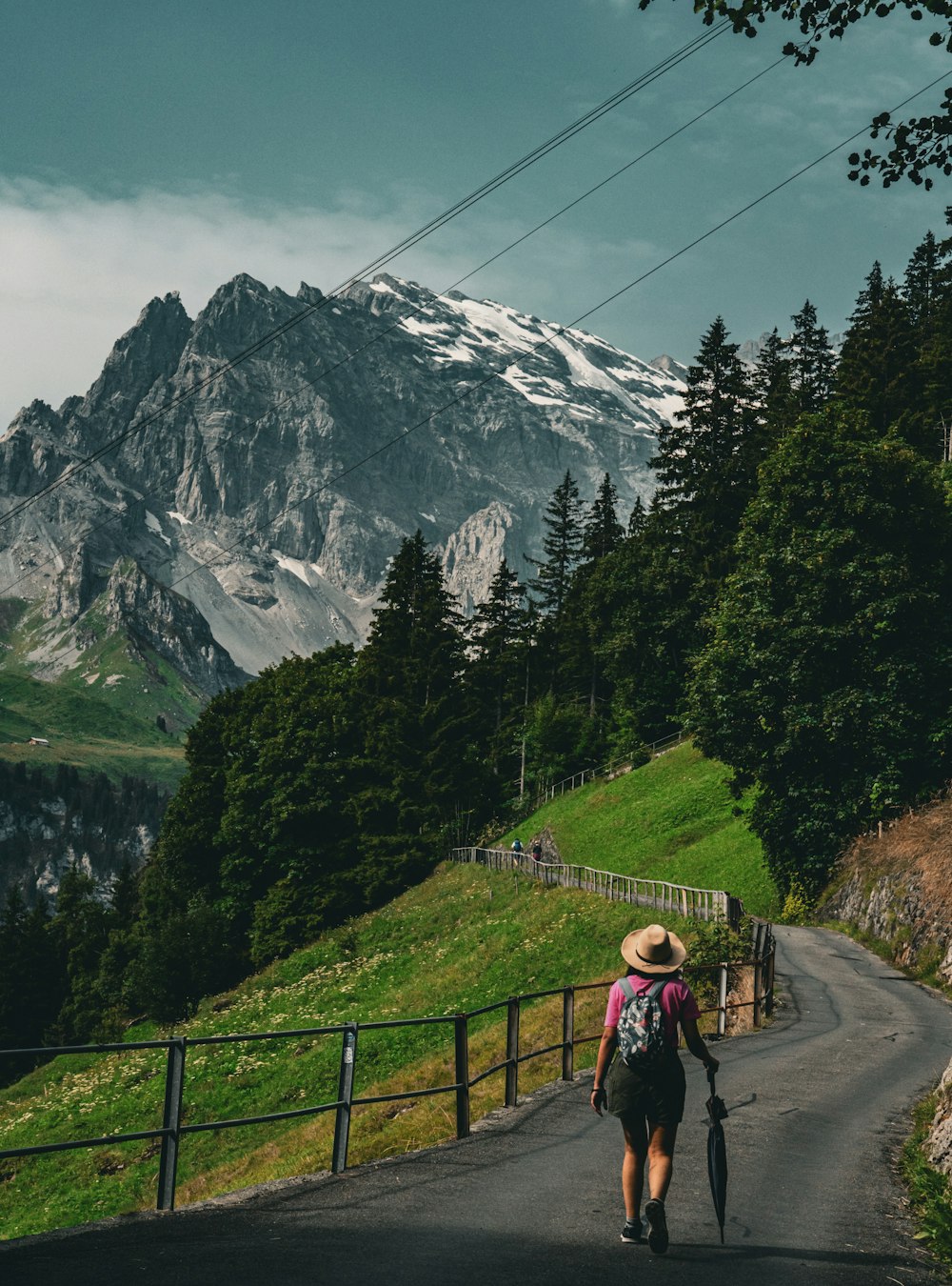 a person walking down a road with a backpack