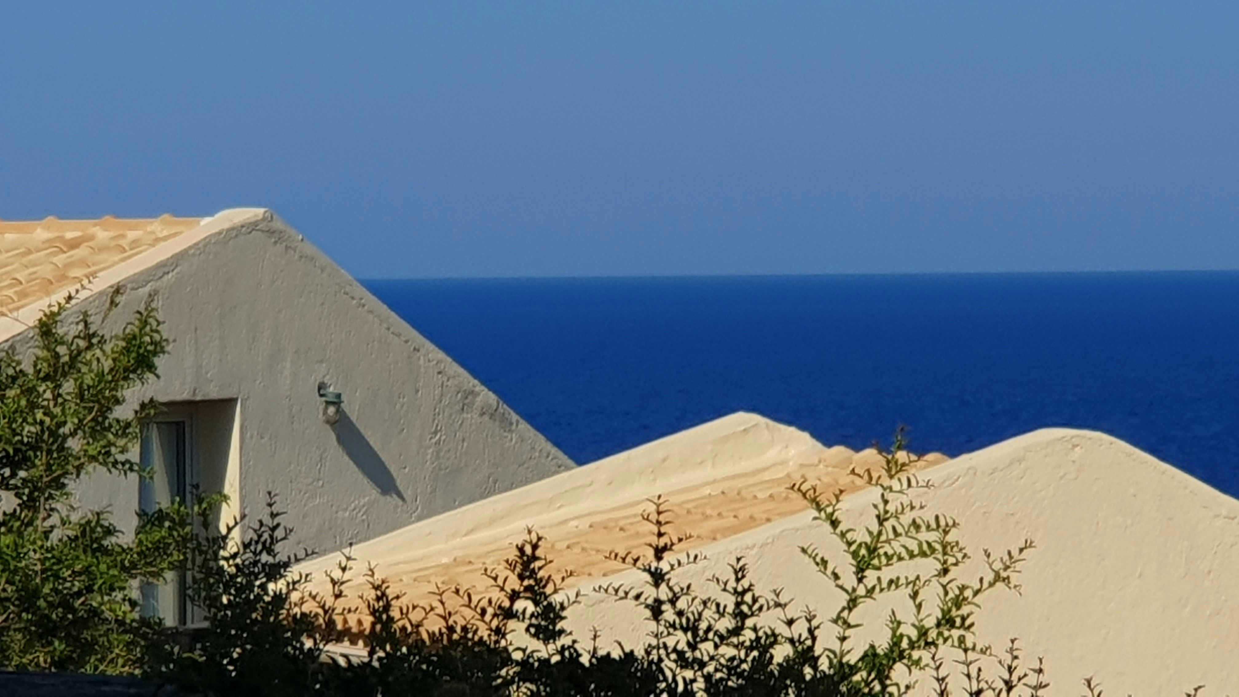 A view of the ocean from a roof of a house