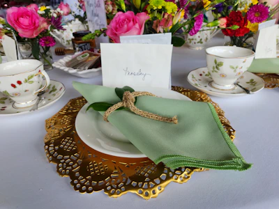 An elegant table setting with name cards and nostalgic memorabilia.