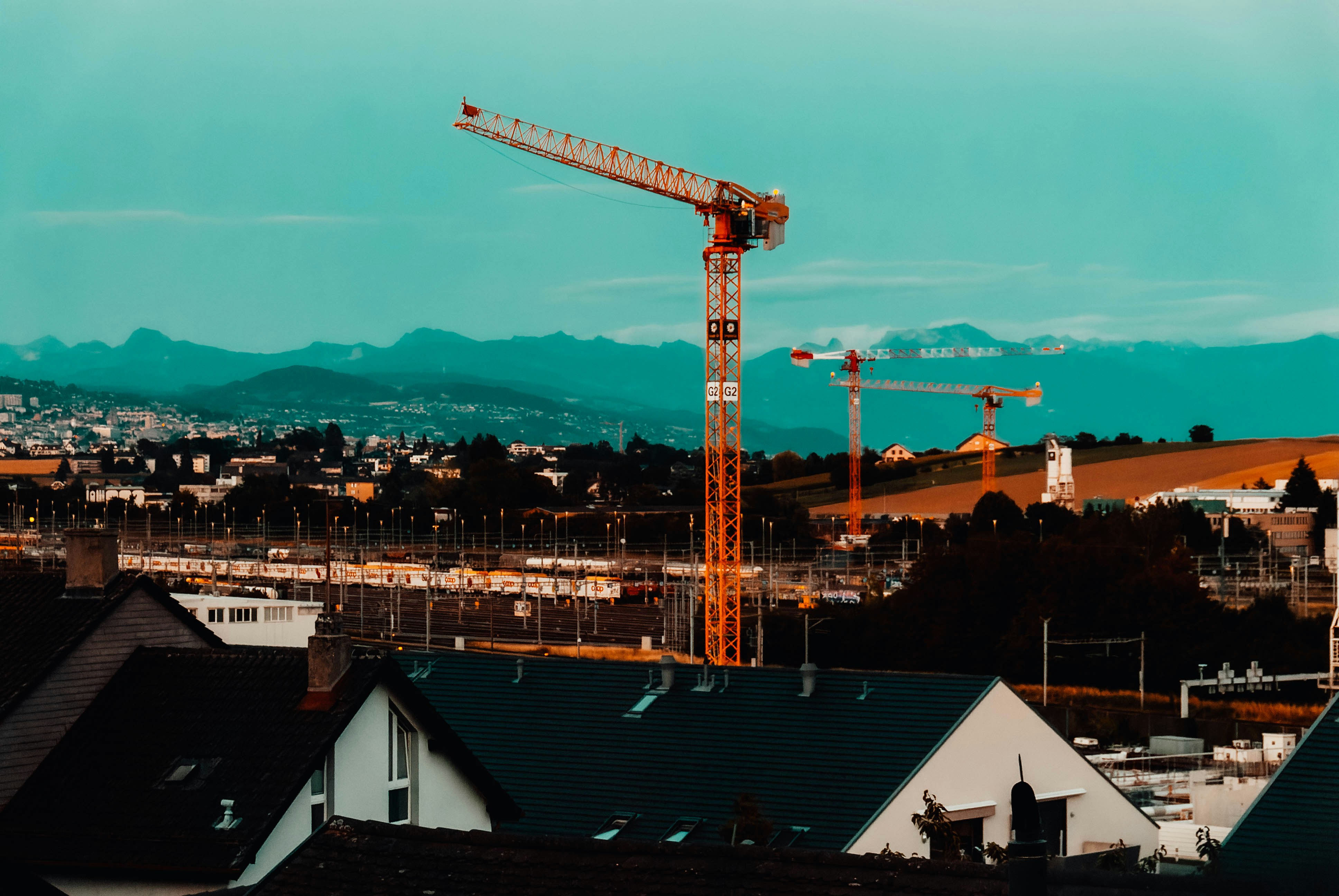 a crane is standing on top of a building