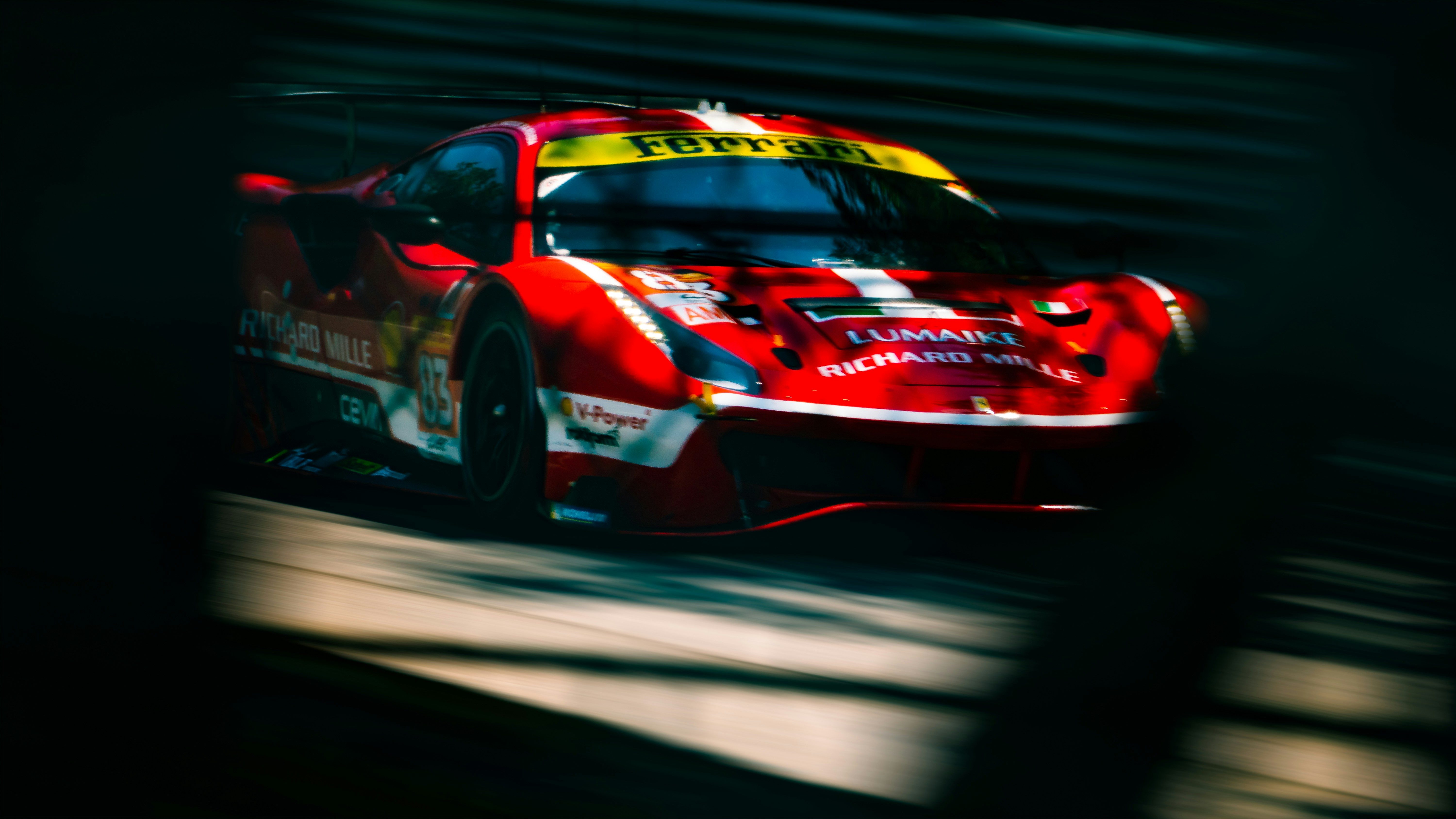 A red race car driving down a race track photo – Free Autodromo ...