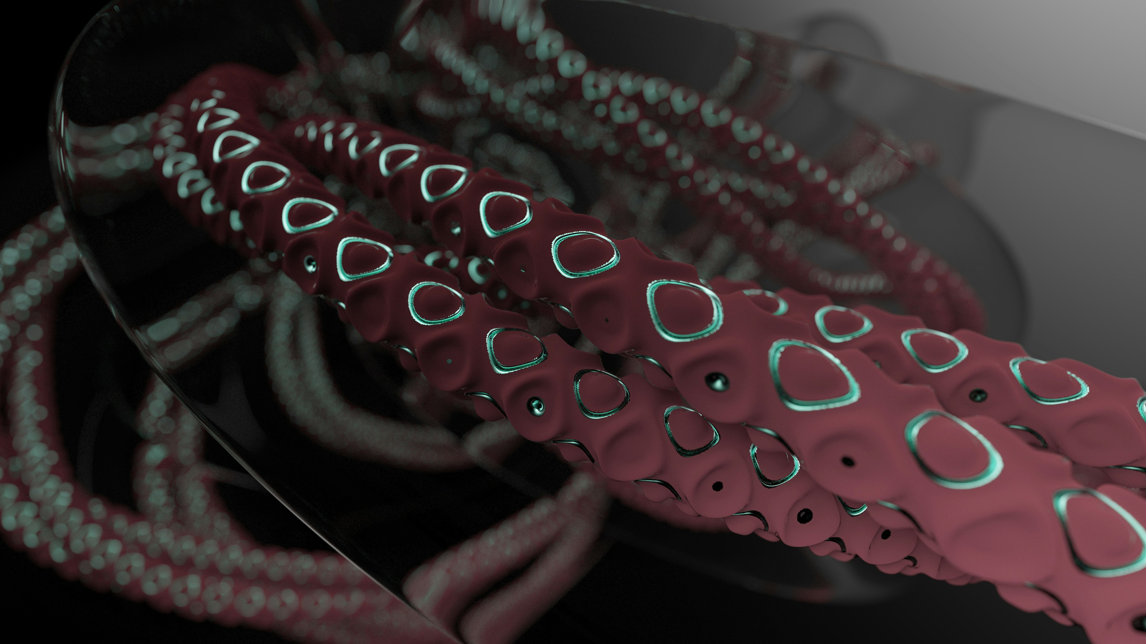 Un primer plano de una mesa de vidrio con un objeto rojo encima