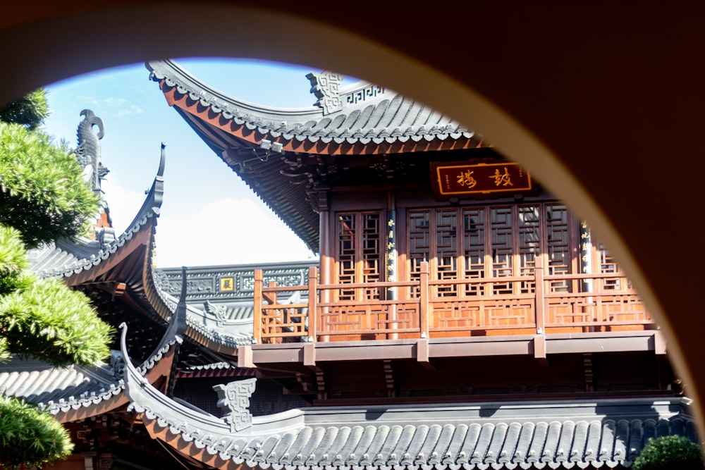 a view of a building through a circular window