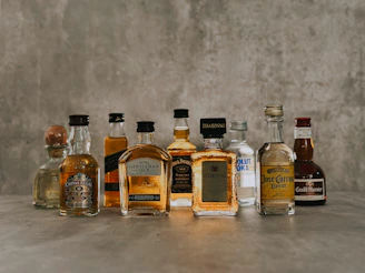 a group of bottles of liquor sitting on top of a table