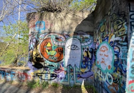 Urban street art blending psychology symbols with spiritual motifs on a gritty wall.