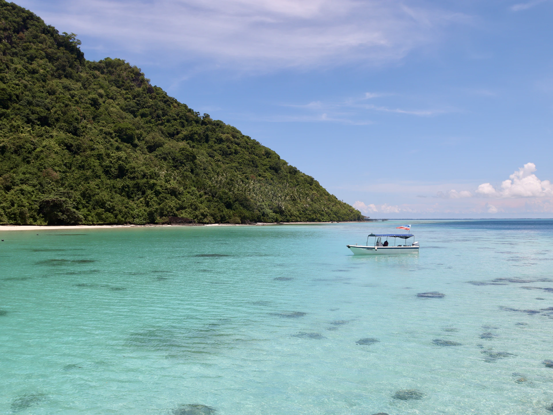 a boat floating on top of a body of water