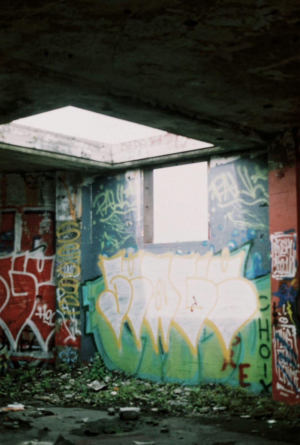 an abandoned building with graffiti all over it