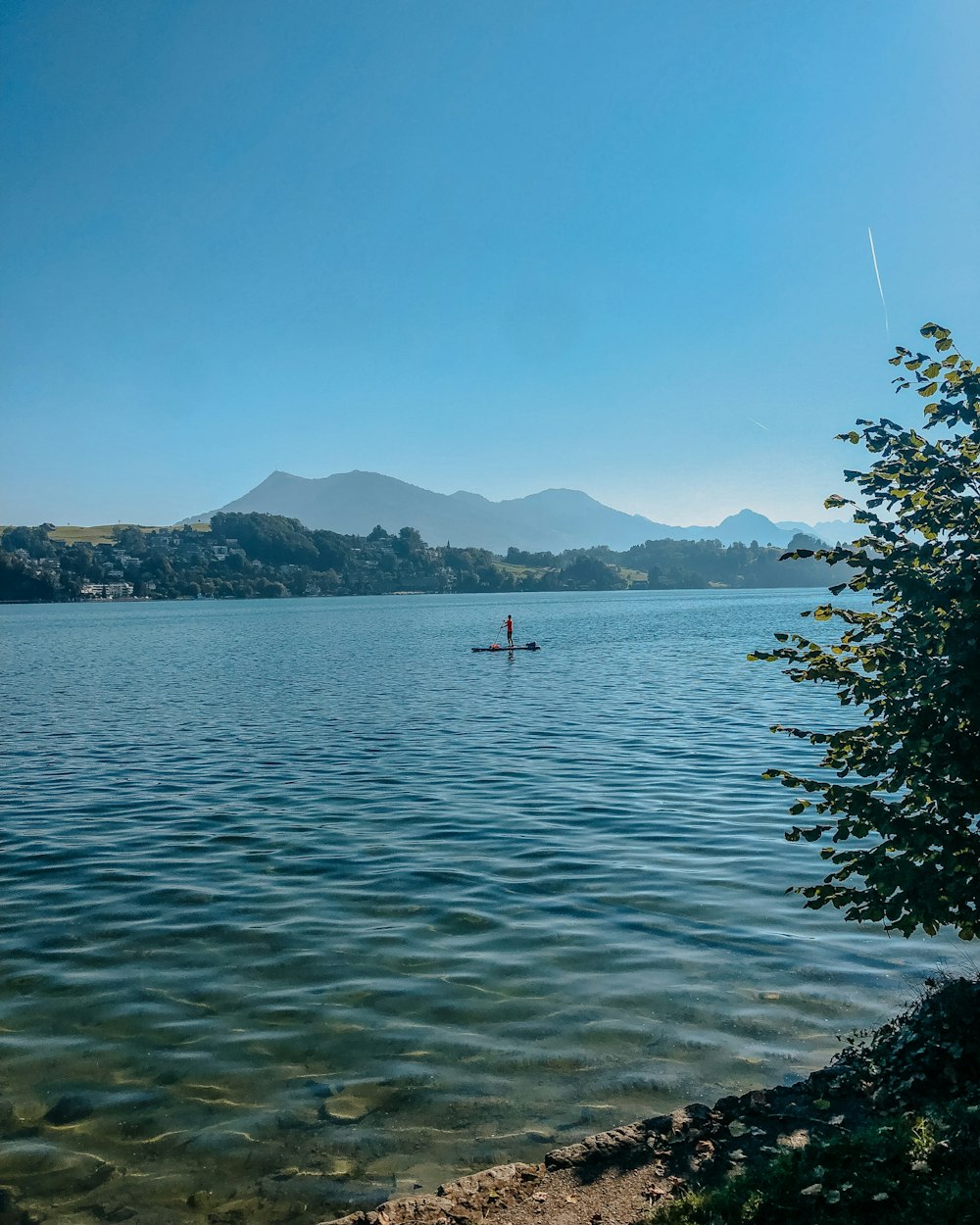 a person in a boat on a large body of water