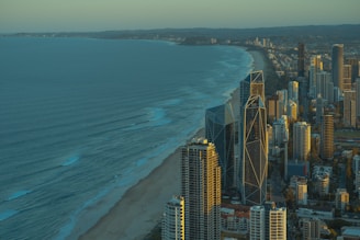 an aerial view of a city and the ocean