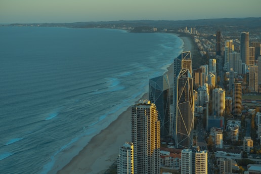 an aerial view of a city and the ocean