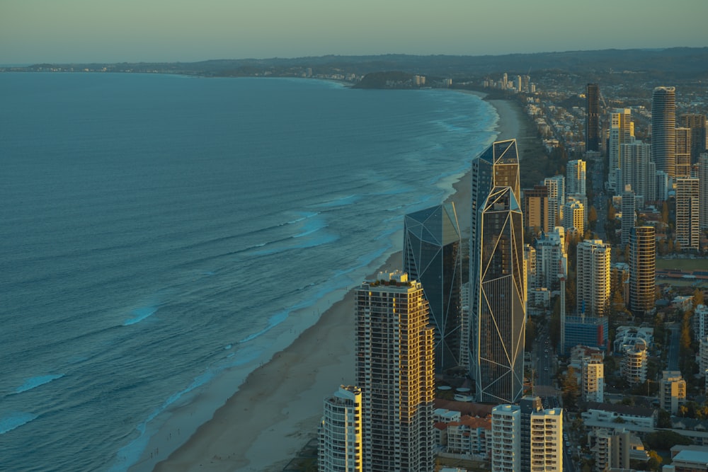 an aerial view of a city and the ocean