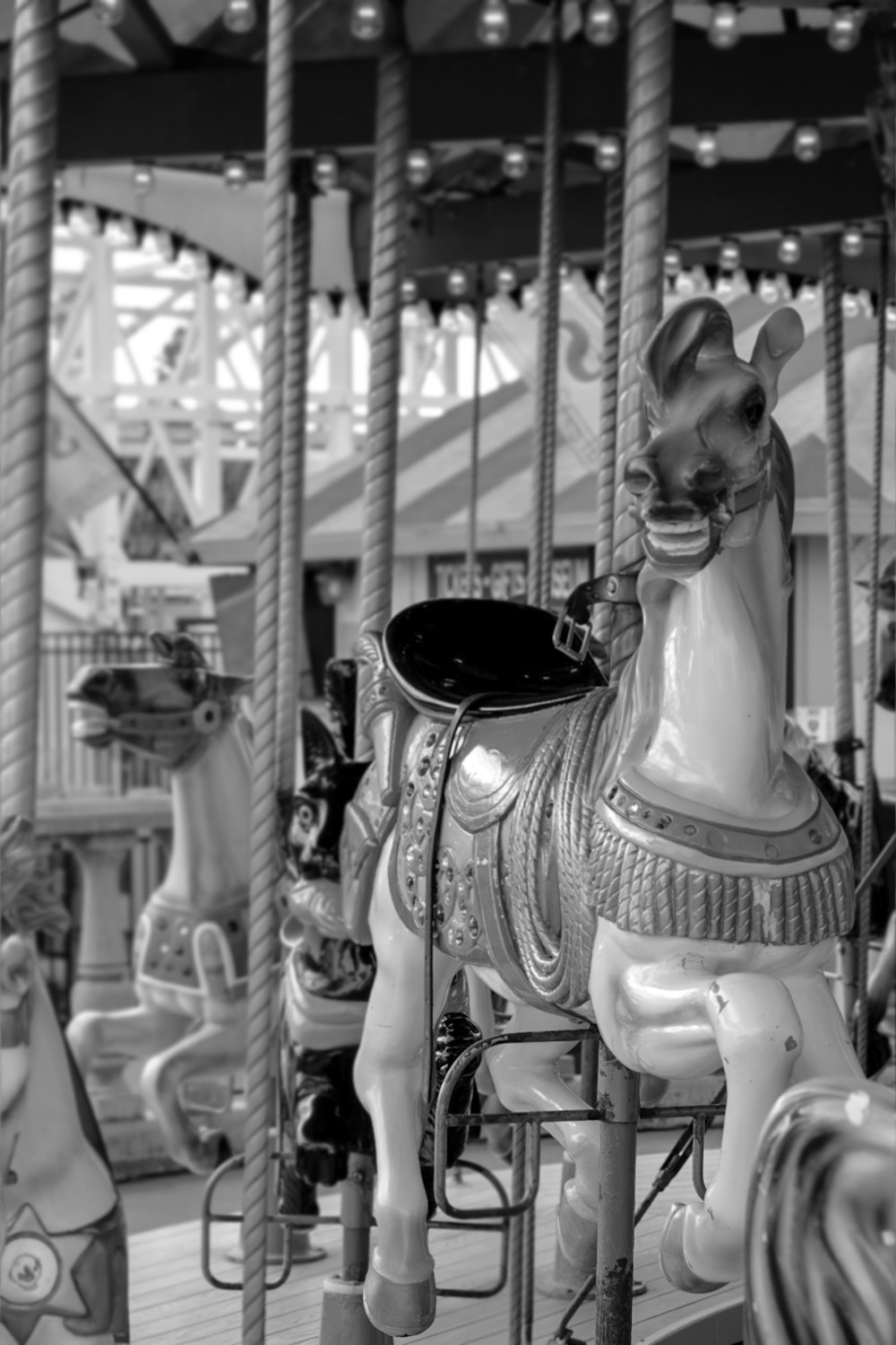 a black and white photo of a merry go round