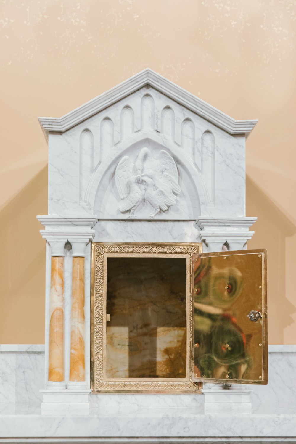 a white fireplace with a painting on the mantle