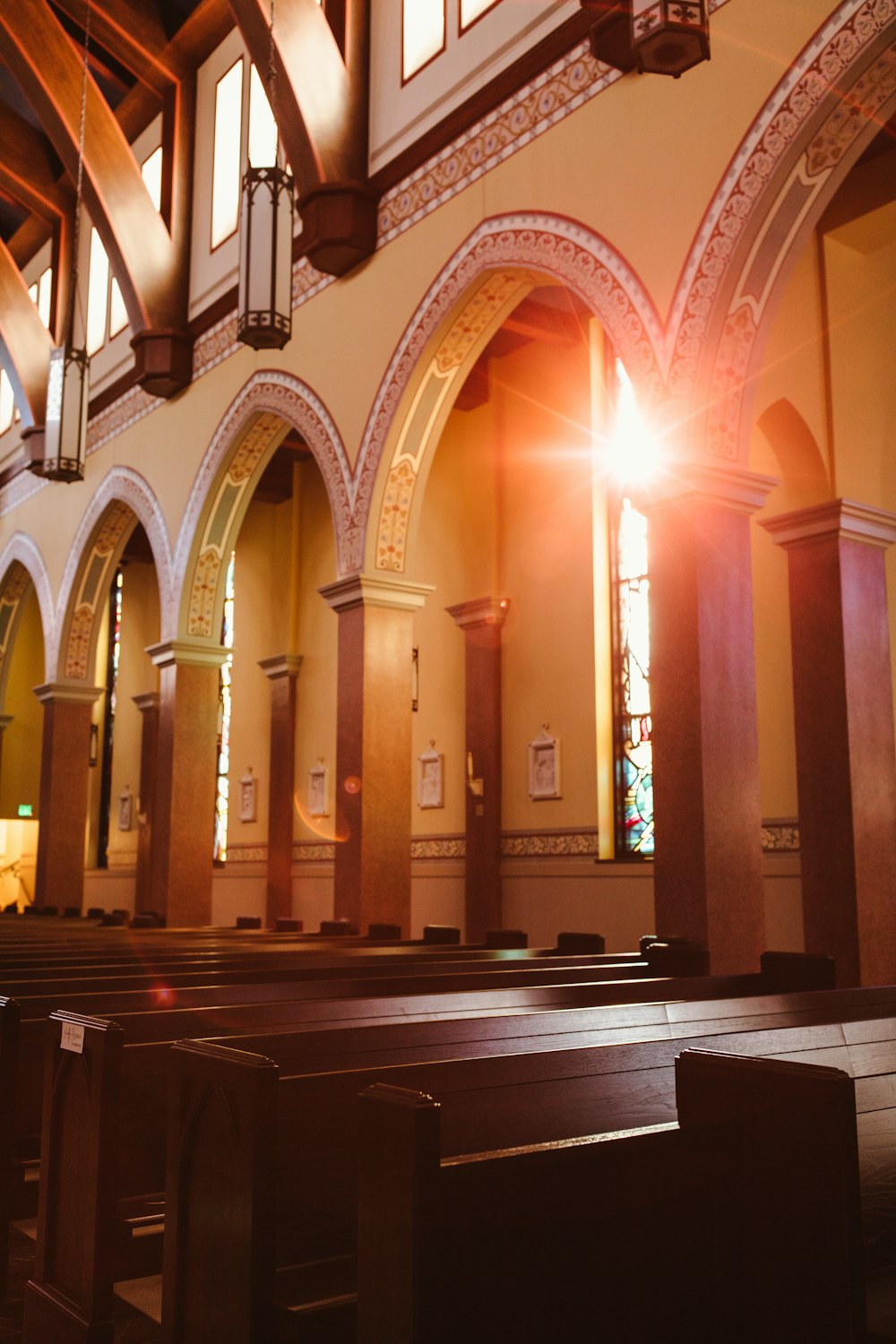the sunlight shines through the windows of a church