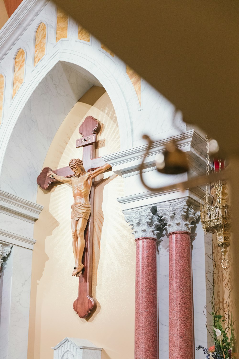 a statue of jesus on a cross in a church