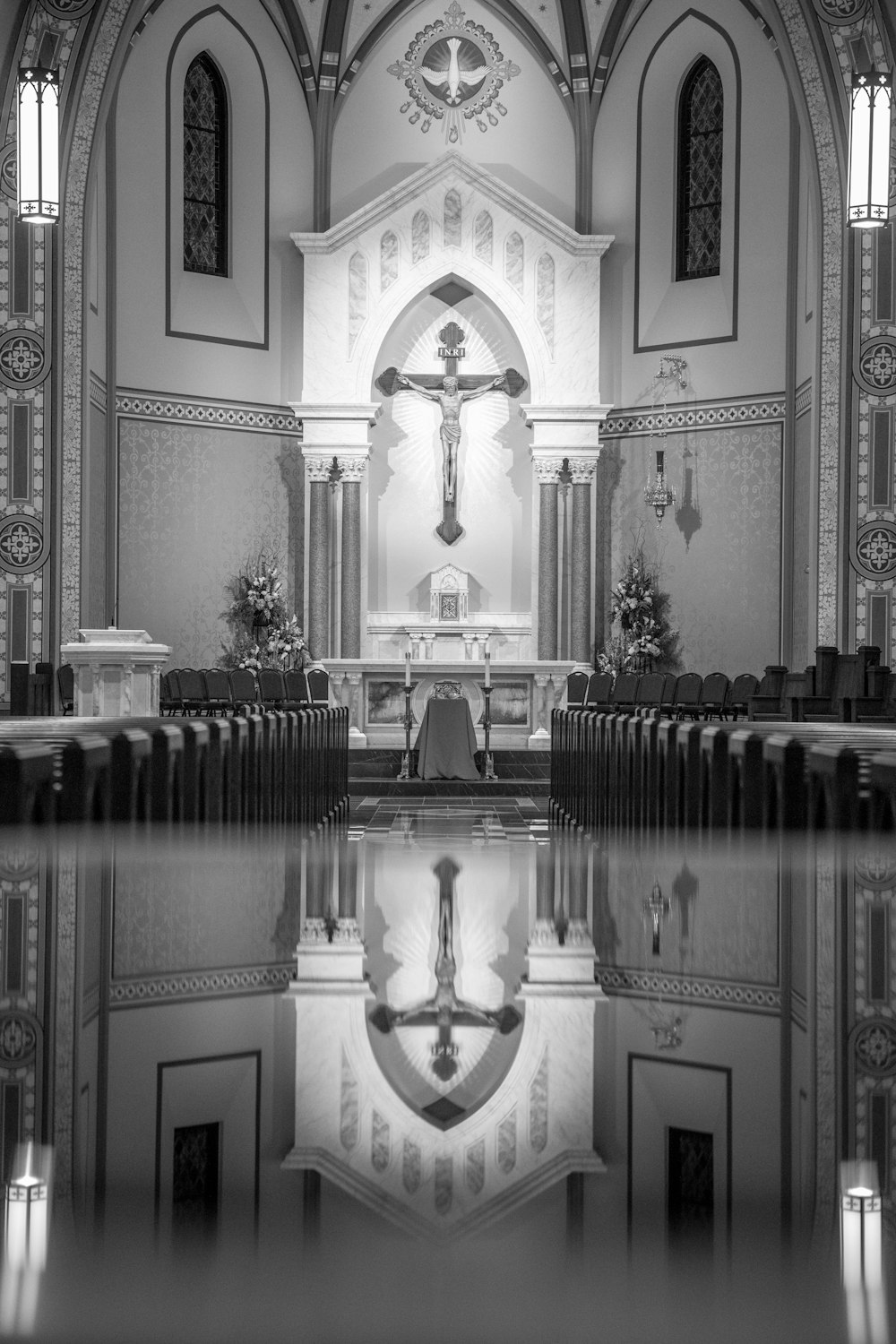 a black and white photo of the inside of a church