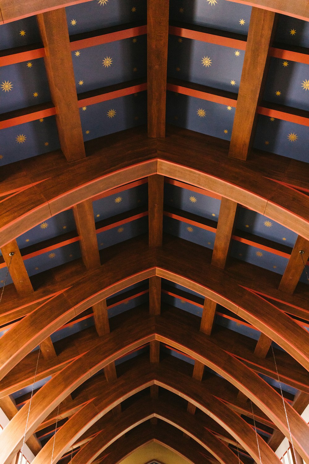 a church with a vaulted ceiling and wooden beams