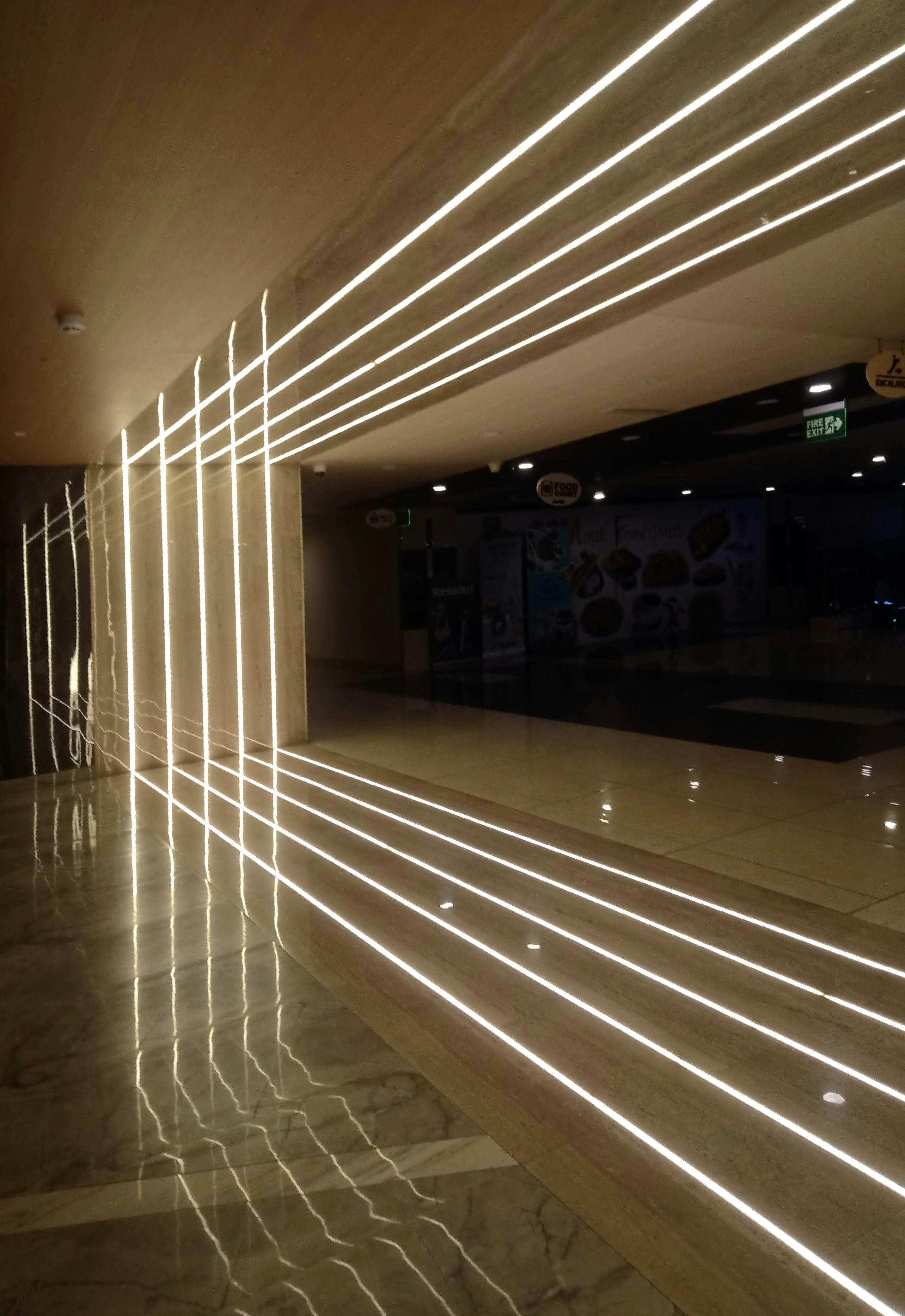 Modern marble floor tiles with clean grout lines in bright sunlit villa interior
